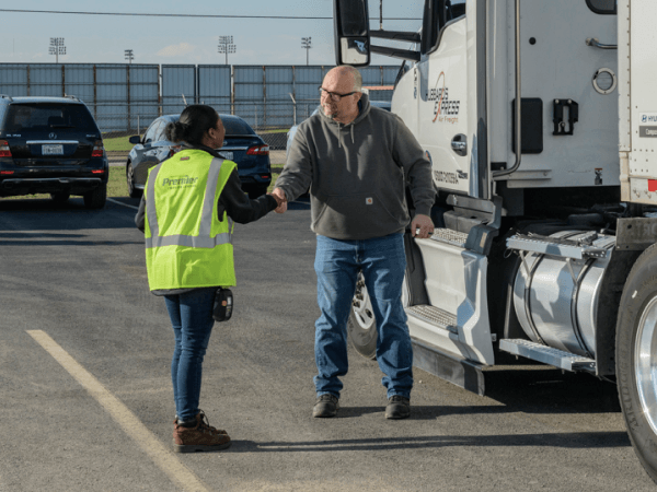 Premier emplyoee and customer shaking hands after closing a deal